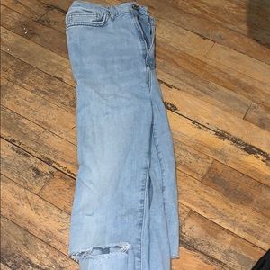 High waisted jeans with rips on knees